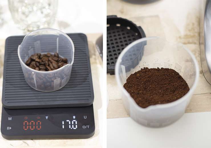 A digital scale displays 17 grams of fresh coffee beans beside an AeroPress spoon. The beans are medium roast, showing a balance of shiny and matte surfaces.